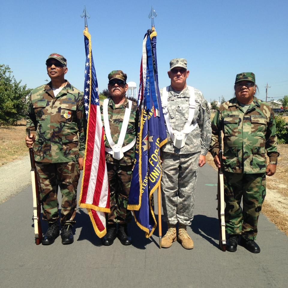 A group of soldiers holding flags with one that says united states of america