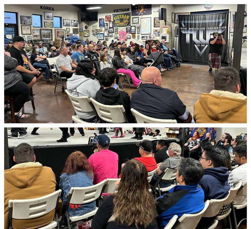 A group of people are sitting in chairs watching a presentation.