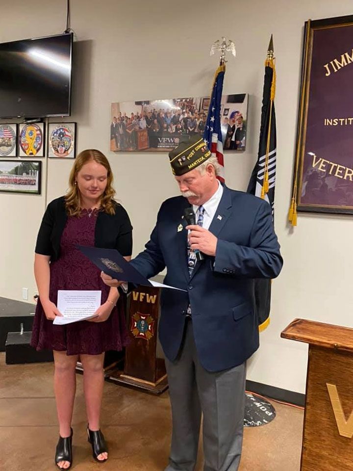 A man and a woman are standing next to each other in a room.