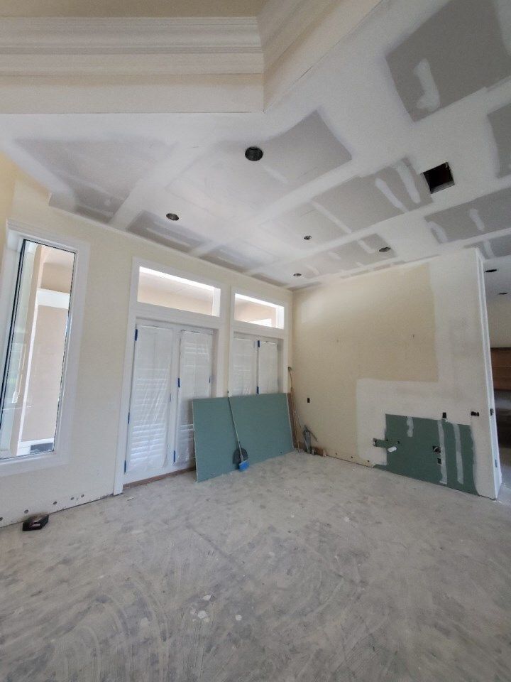 An empty room with a ceiling that has a hole in it — Naples, FL — Treeline Building