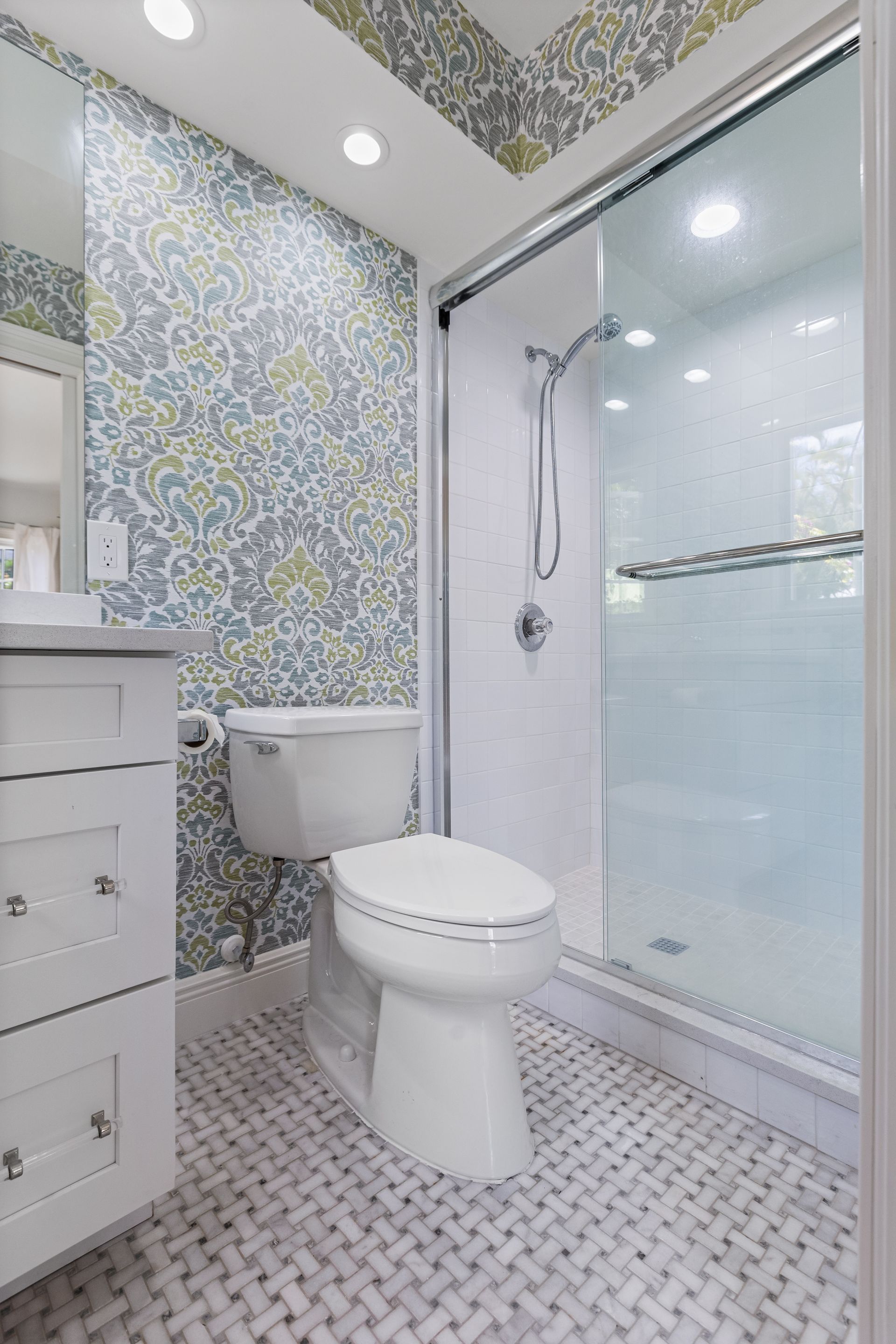 A bathroom with a toilet, sink and shower — Naples, FL — Treeline Building