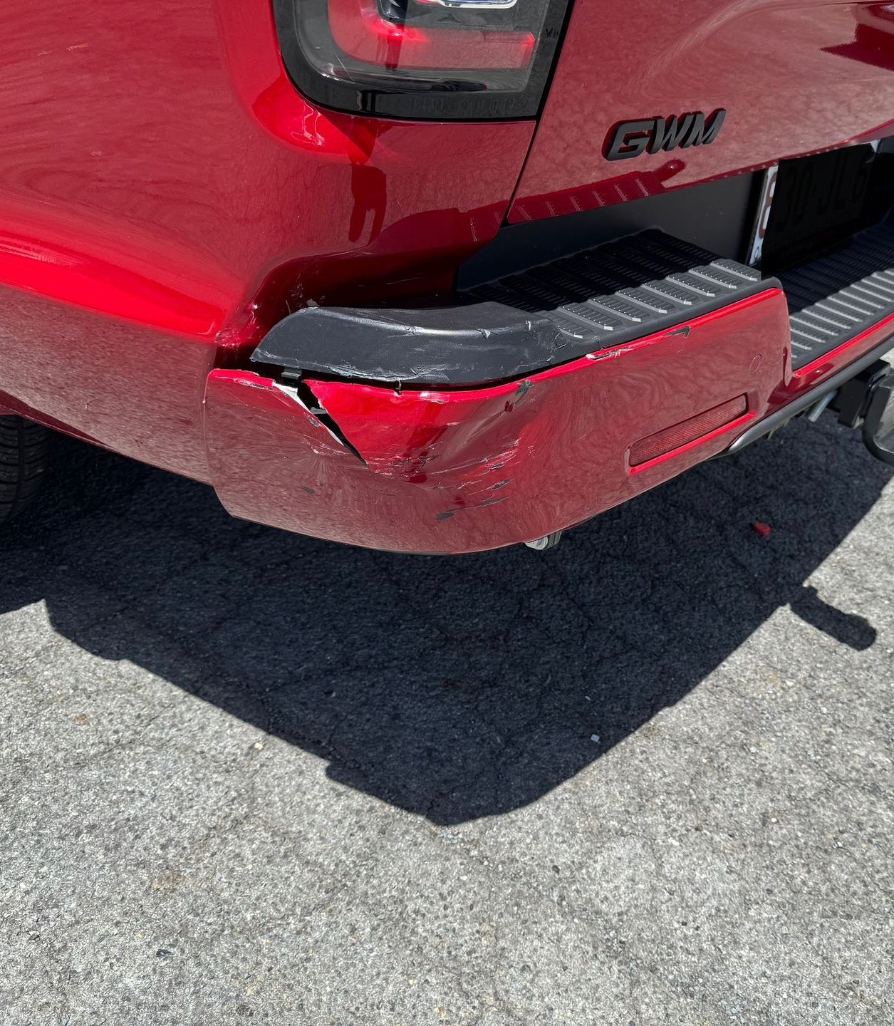 A Silver Car With A Damaged Bumper Is Parked In A Garage โ Platinum Paint & Panel Southport In Southport, QLD