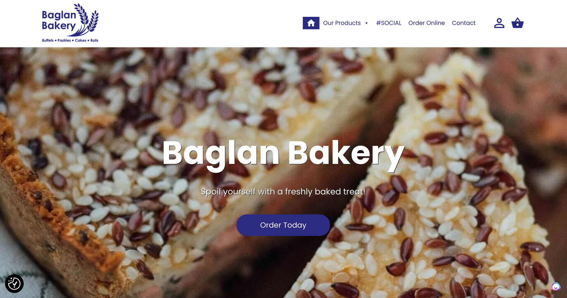 The website for bagian bakery shows a slice of cake with sesame seeds on it.