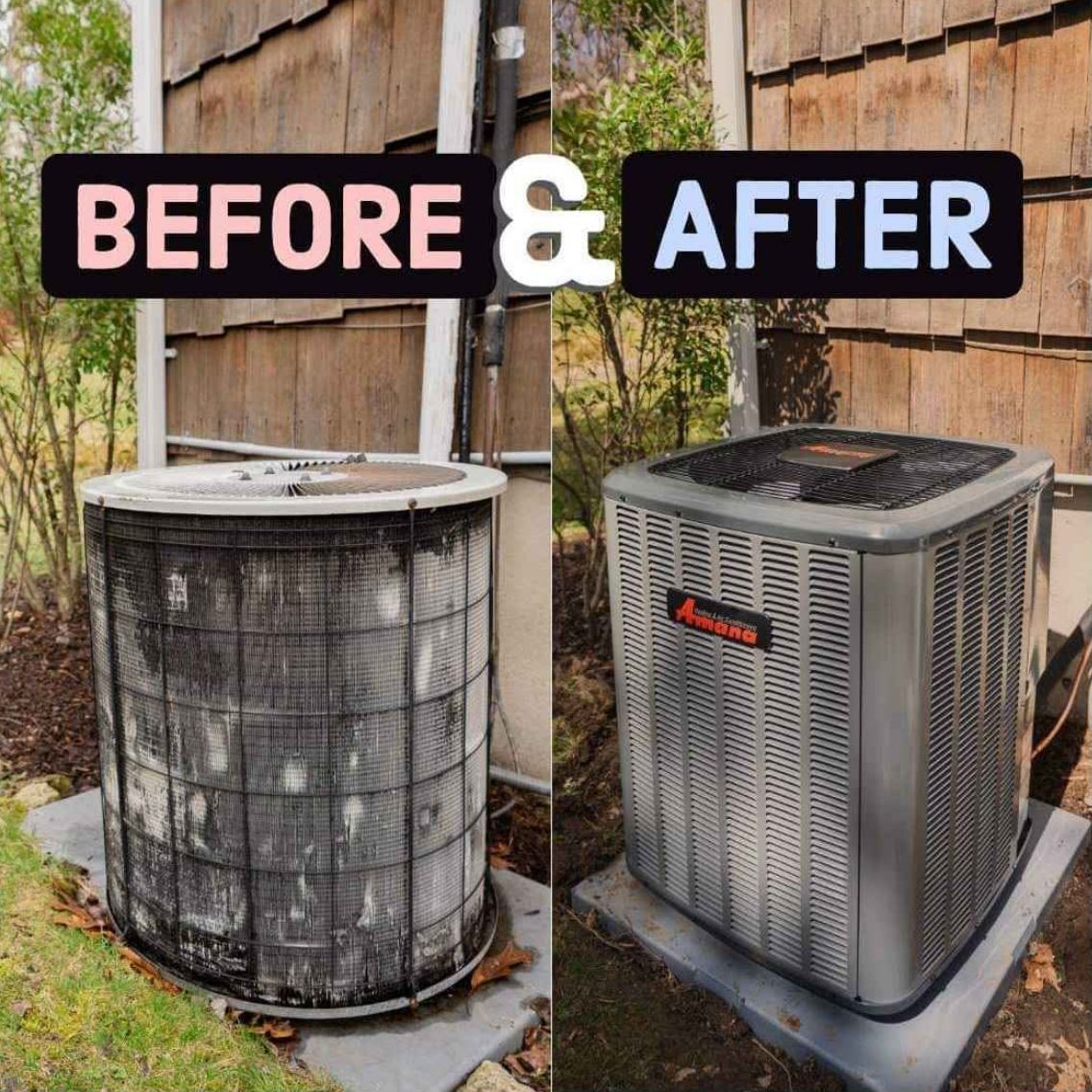 Air conditioning unit next to a brick wall with bushes and grass.