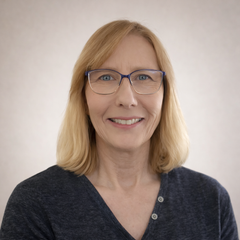 Jamie Letcher, virtual assistant and founder of Wellnix, smiling in headshot on About page