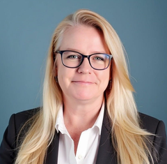 Jamie Letcher, virtual assistant and founder of Wellnix, smiling in headshot on About page