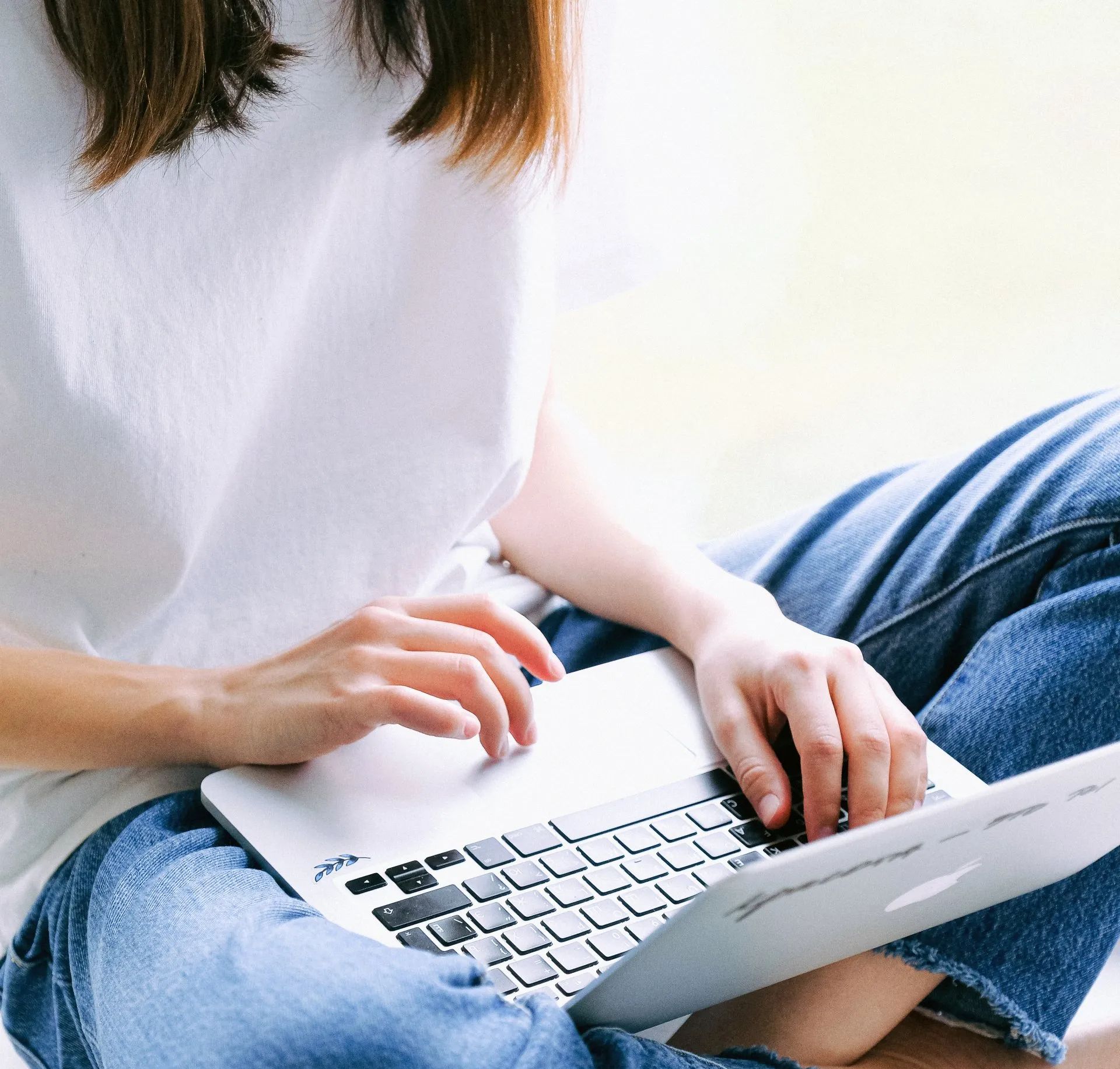 Virtual assistant using laptop to handle outsourced tasks for therapists in private practice