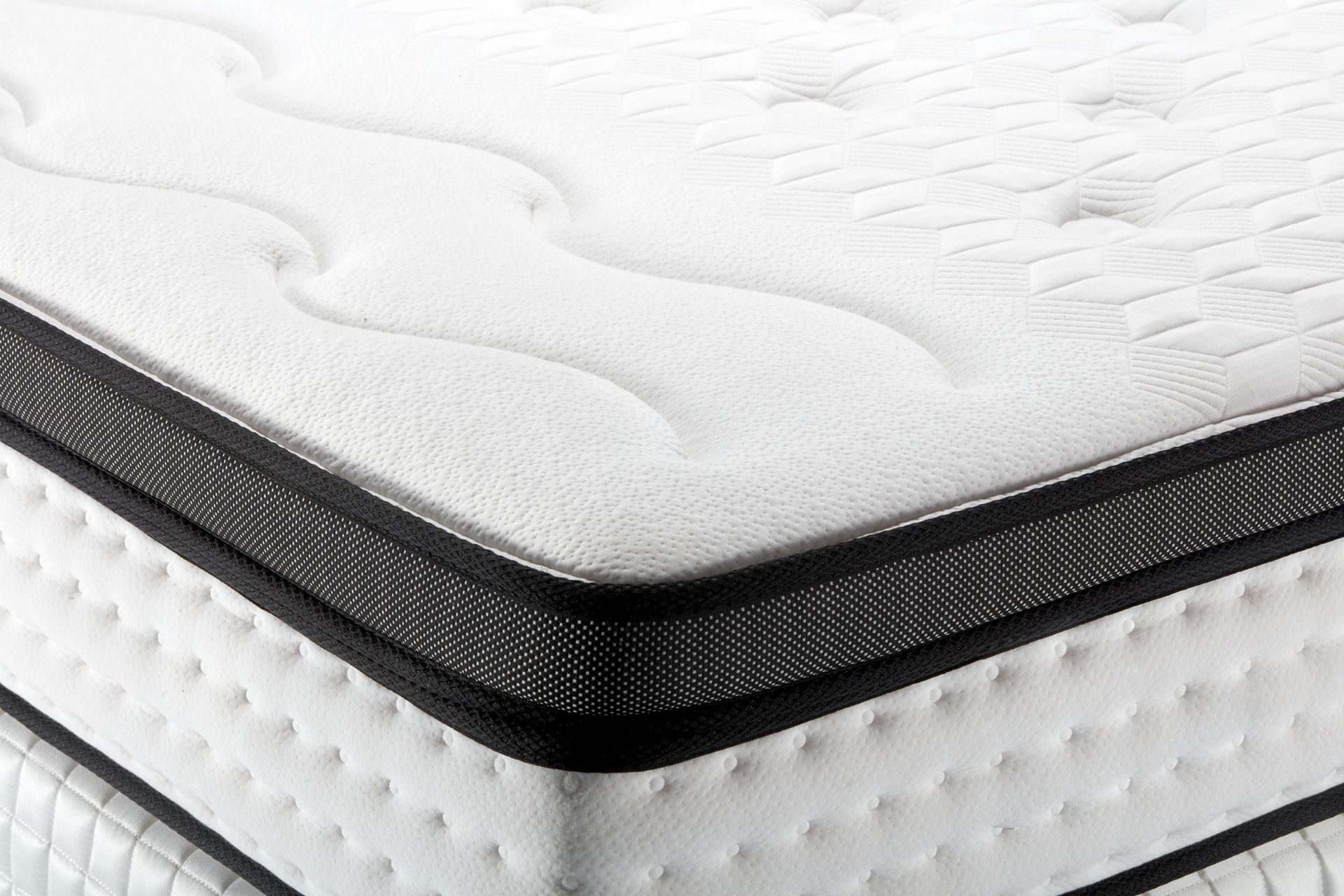 Close-up of mattress sets at a store.