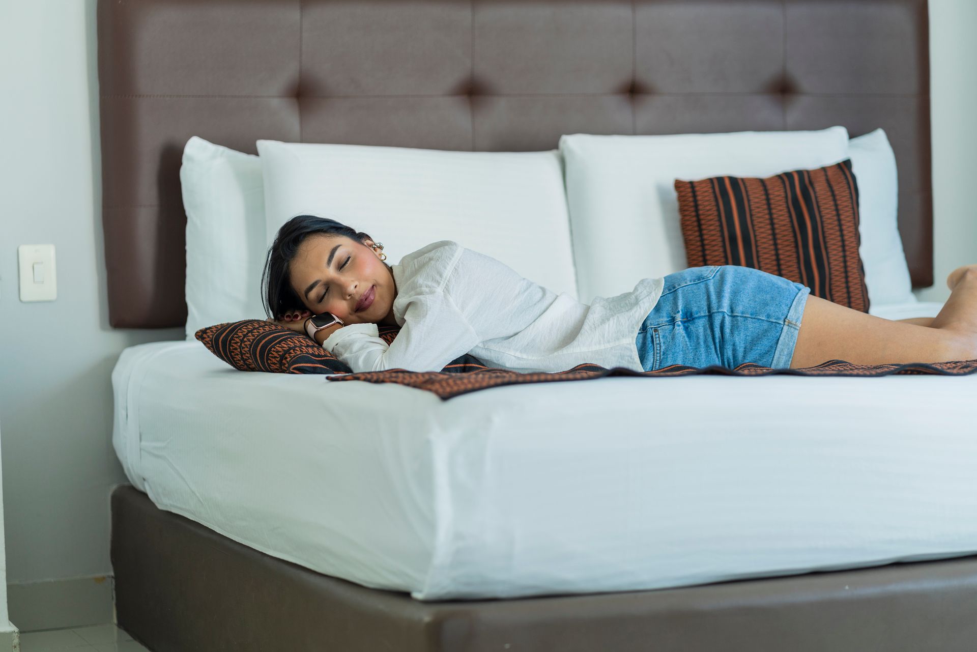 Young woman sleeping on a bed.