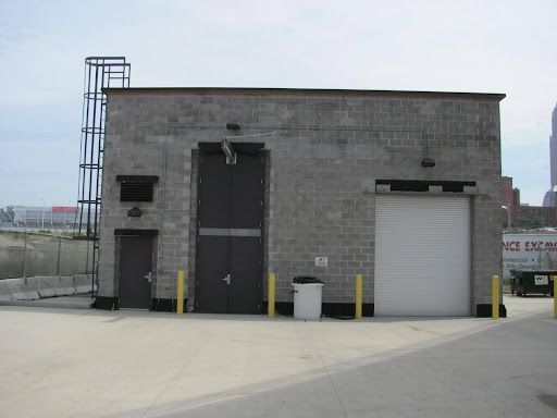 A large brick building with a white garage door