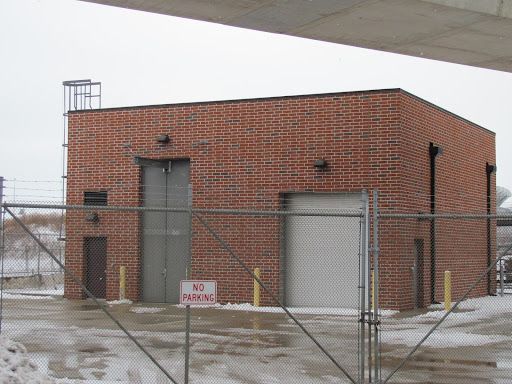 A brick building with a no parking sign in front of it
