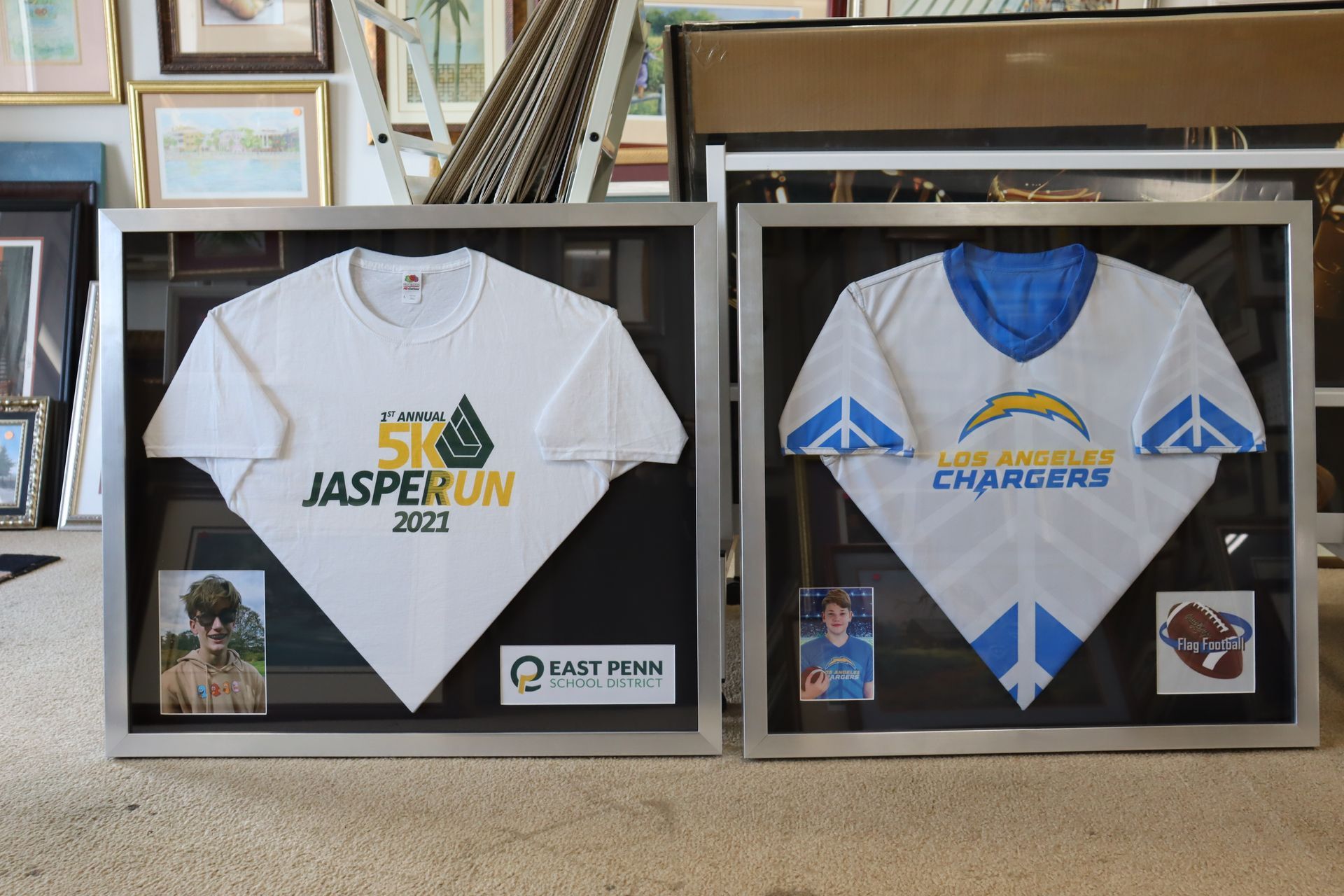 Two framed shirts in a shop: a white 