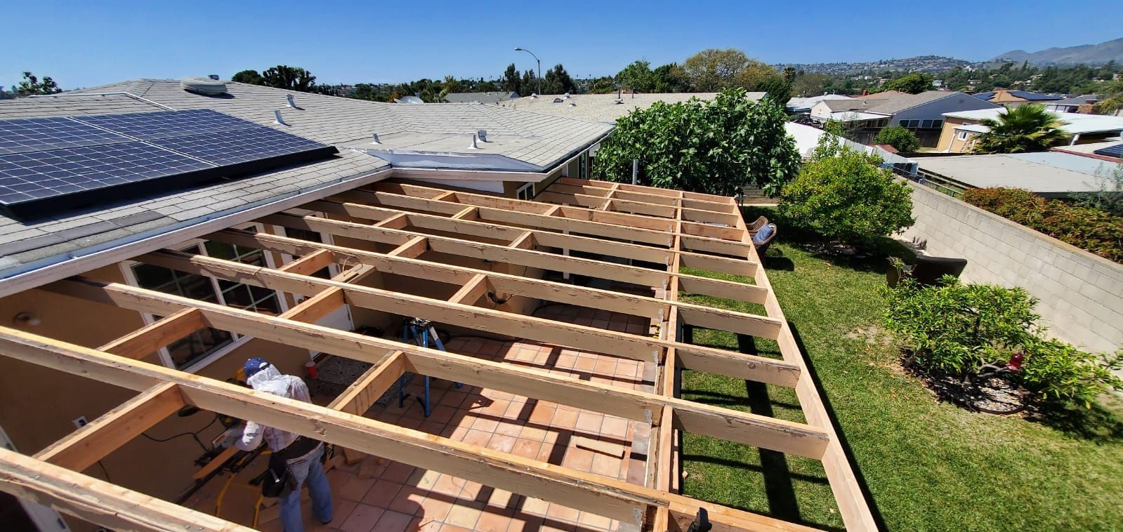 Worker Installing Residential Solar — San Diego, CA — United Pro Builders