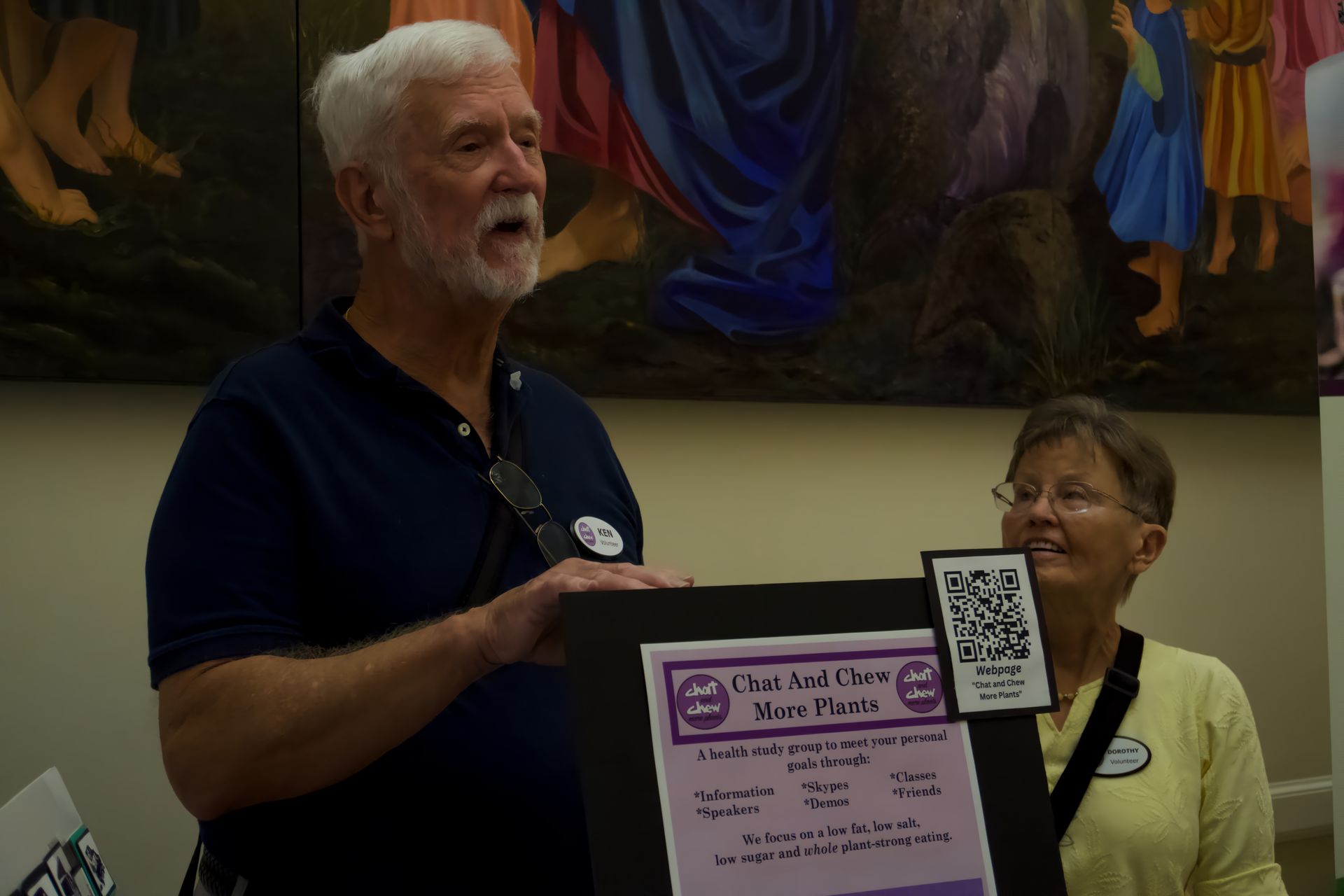 A man is holding a sign that says 