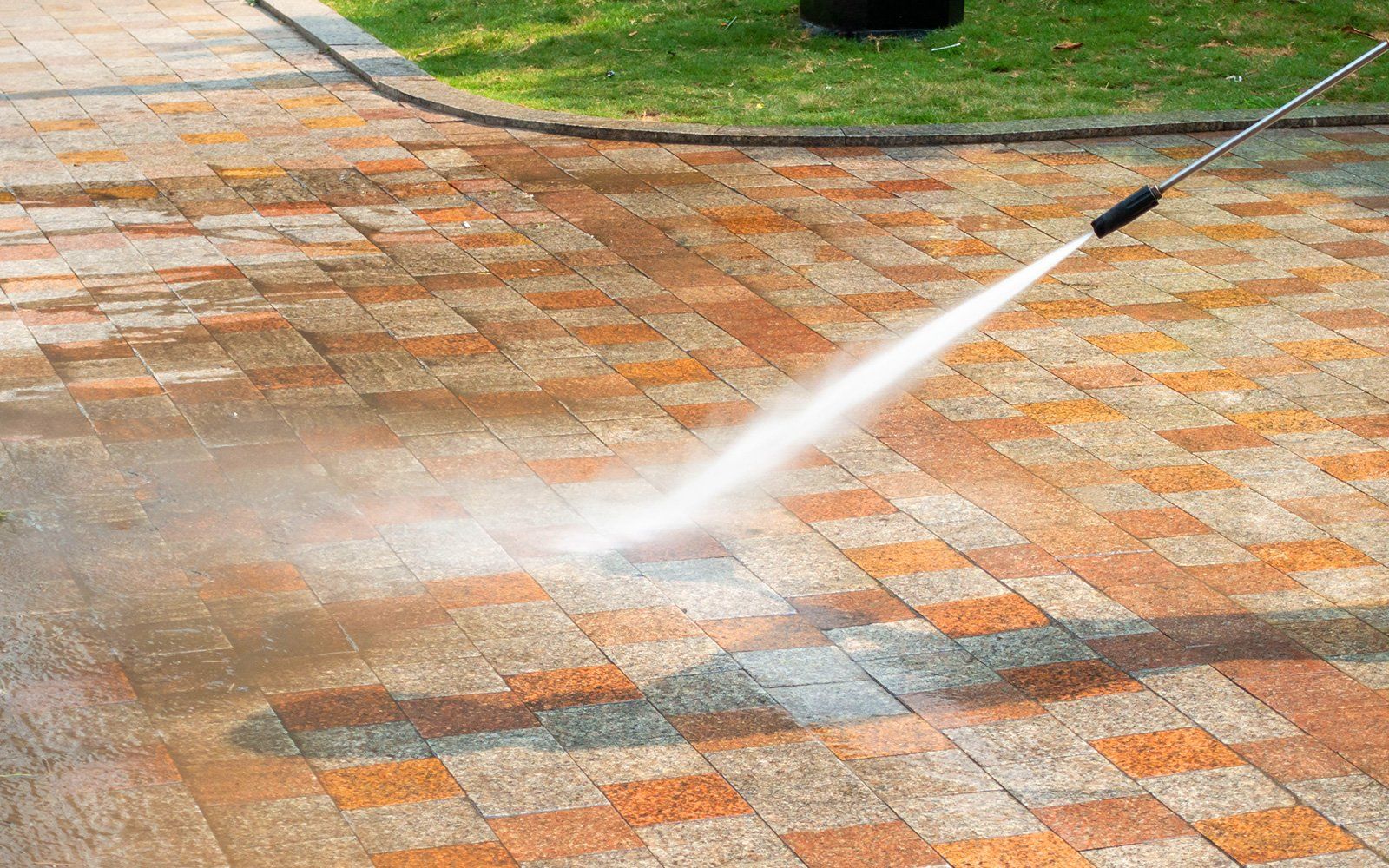 Gloved hand meticulously cleaning a window using a damp rag and spray, ensuring a streak-free shine.