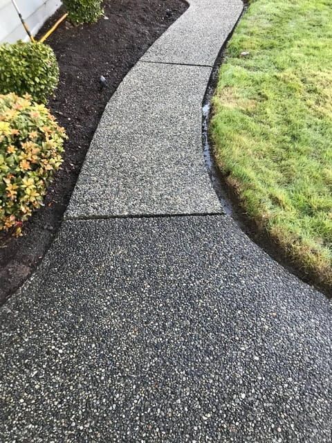 a walkway that is next to a house