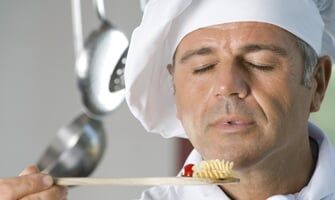 Chef Holding Spoon of Pasta