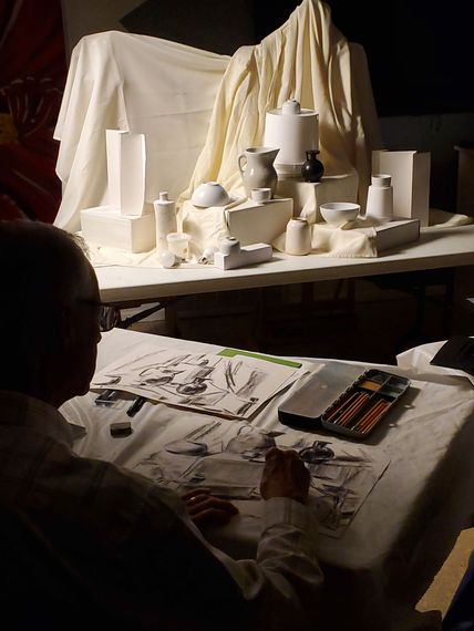 A group of people are sitting at tables in a room.