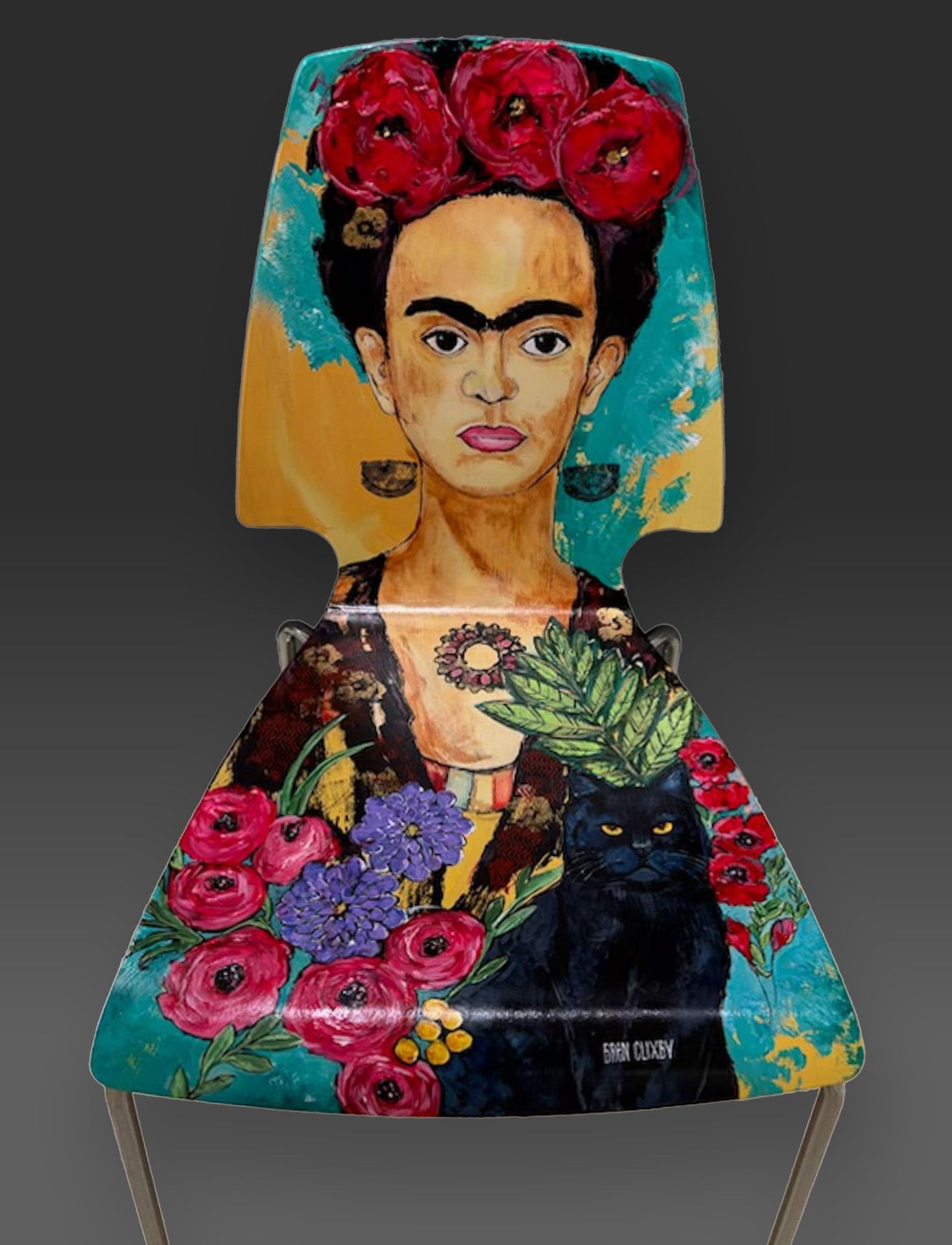 A chair with a painting of frida kahlo on it