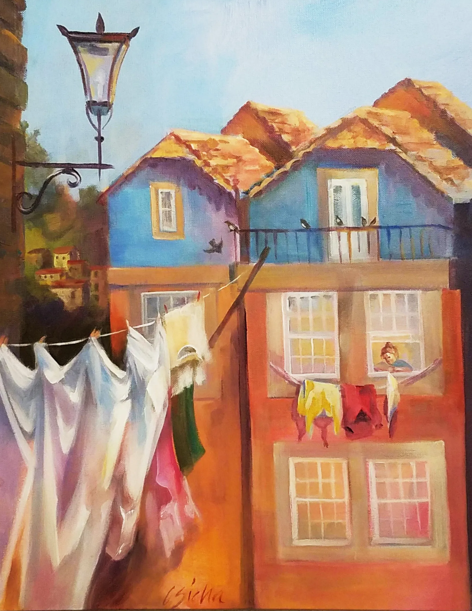 A painting of a row of houses with clothes hanging on a line