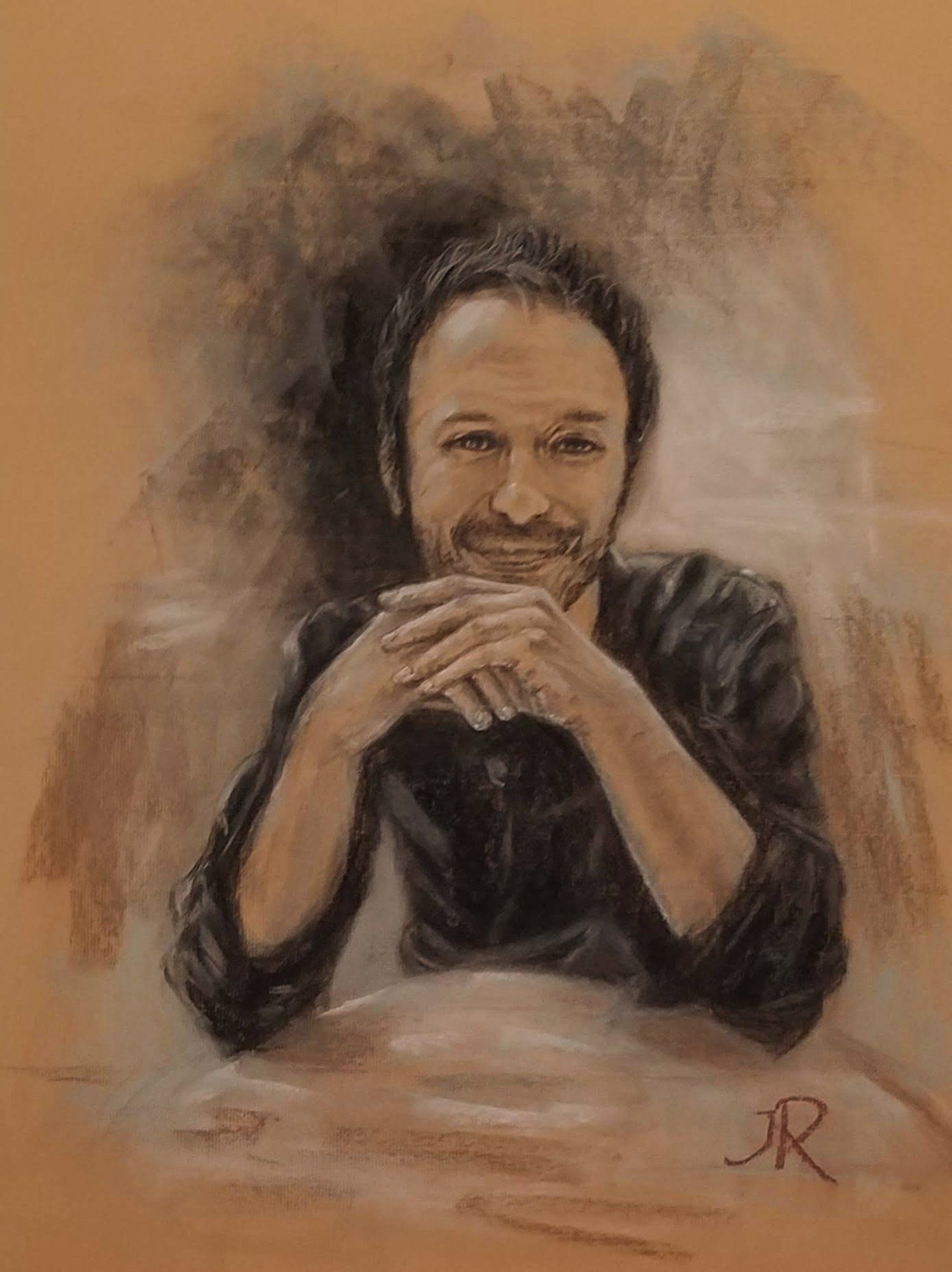 A drawing of a man sitting at a table with his hands folded.