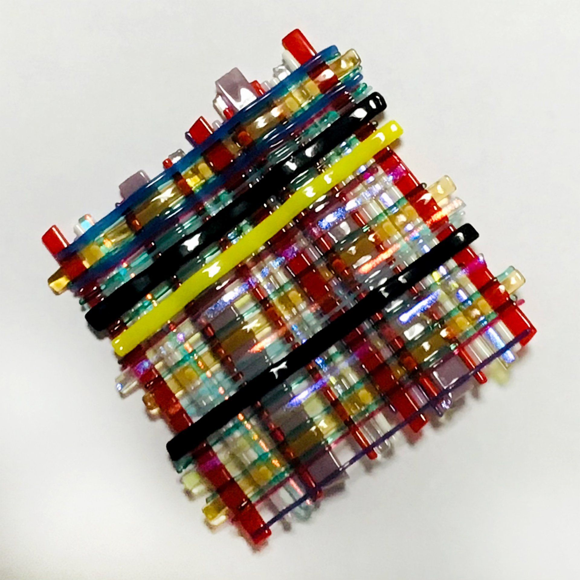 A bunch of colorful beads are stacked on top of each other