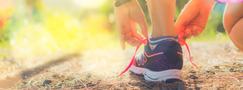 A person lacing up their trainers