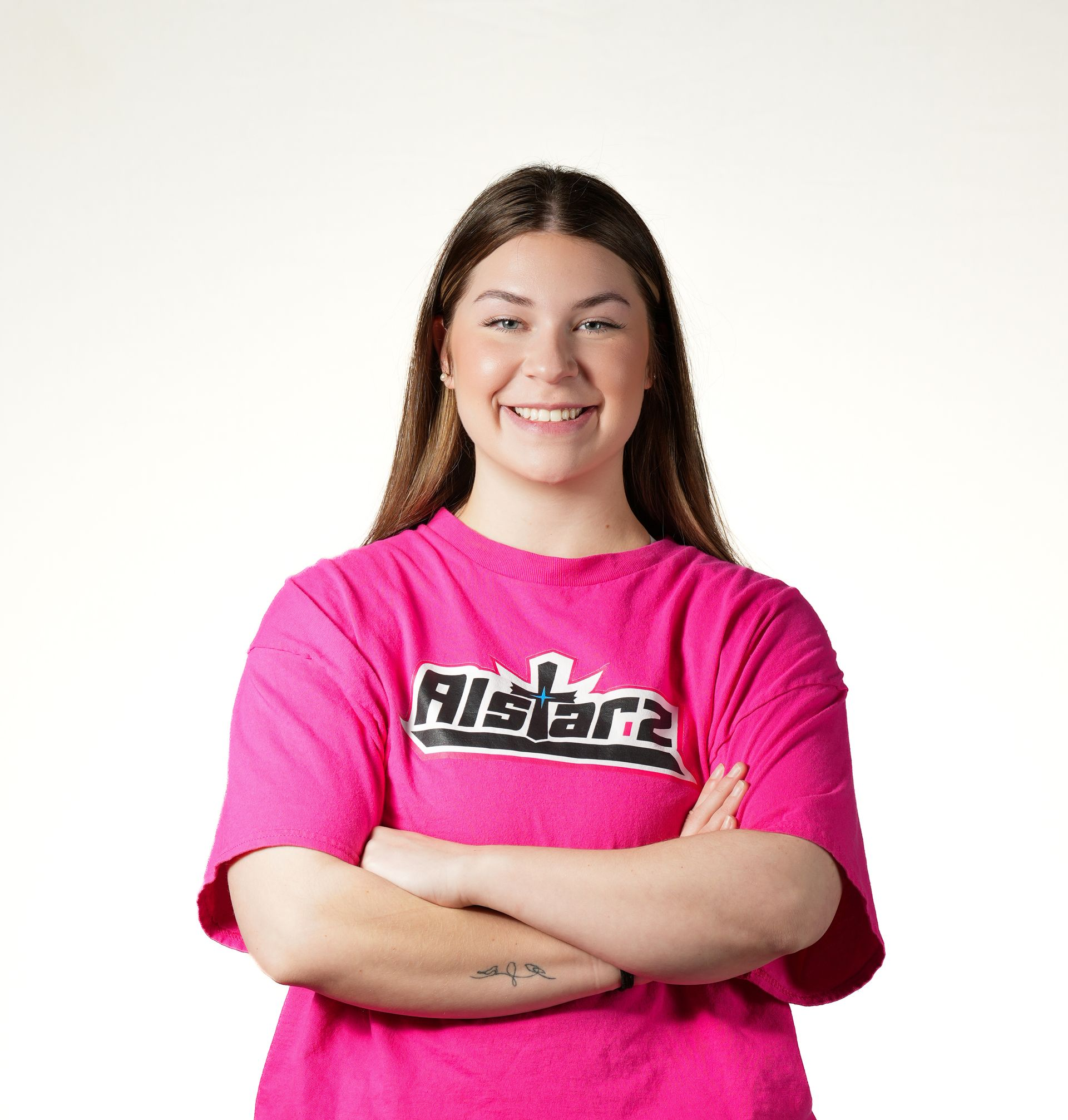 A woman is wearing a blue t-shirt with the word aca on it.