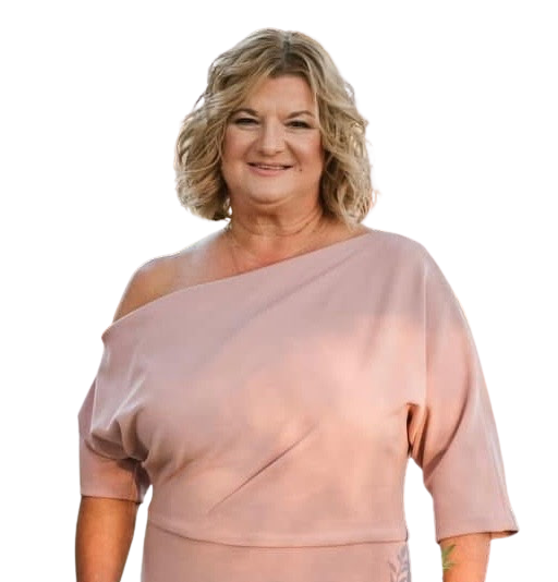 A cheerleader wearing a red top and skirt is standing with her hands on her hips.