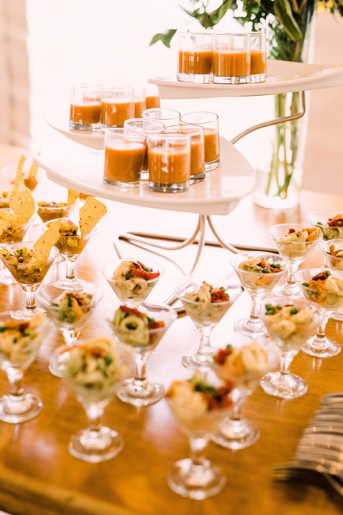 A table topped with a variety of appetizers and drinks.