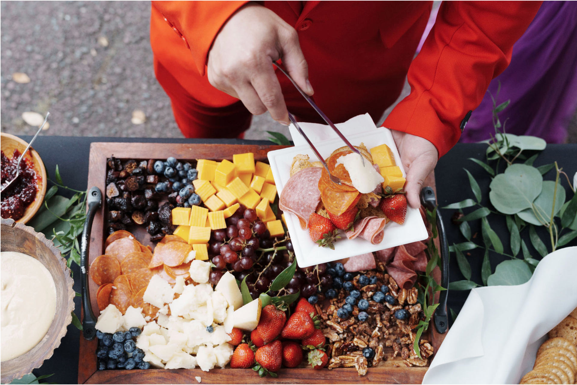 A person is cutting a piece of food on a cutting board.
