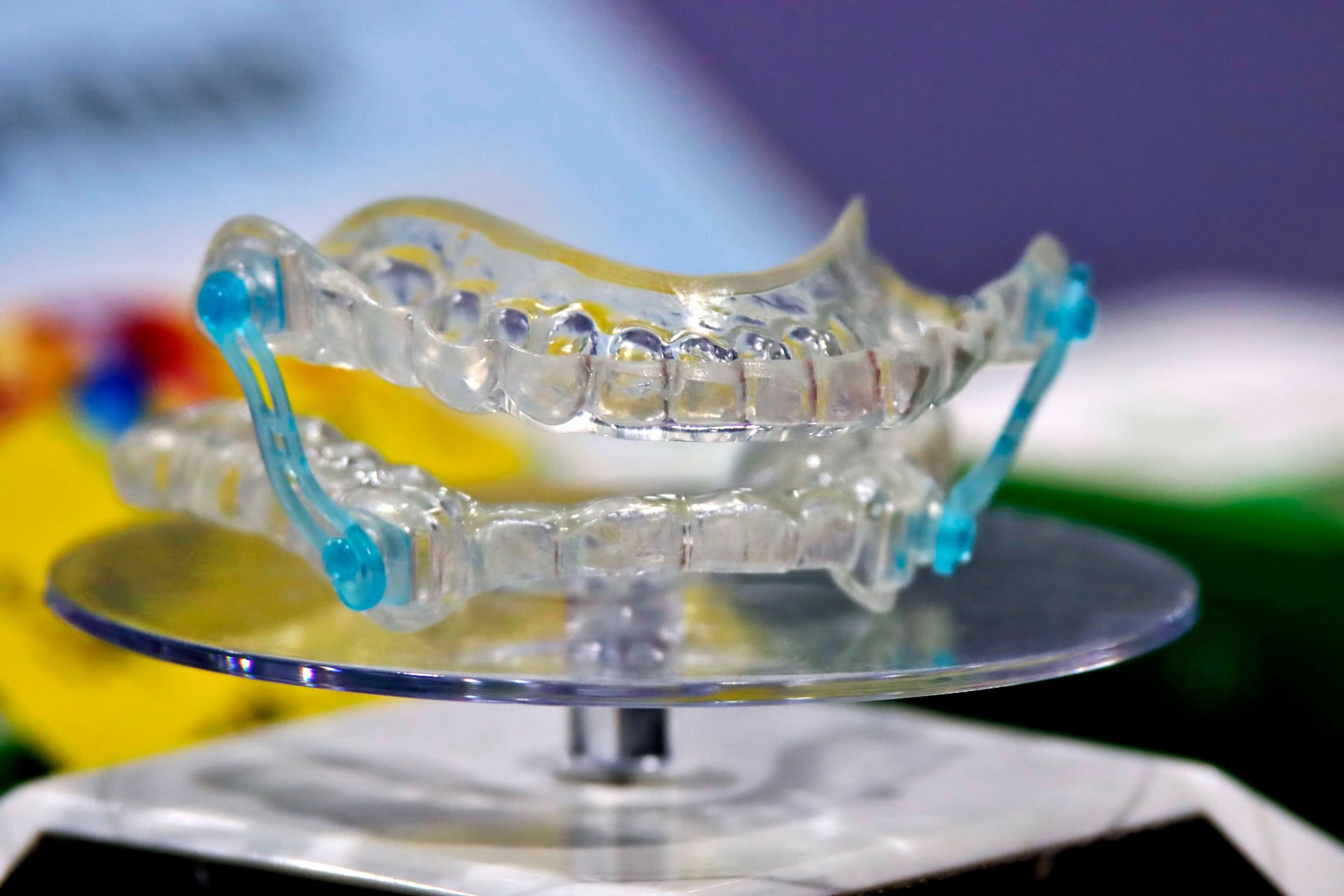 A close up of a dental device on a stand.