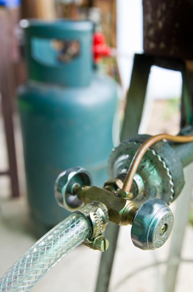 Close-Up of a Gas Regulator With a Hose Connected to a Propane Tank — ABV Plumbing In Woy Woy, NSW