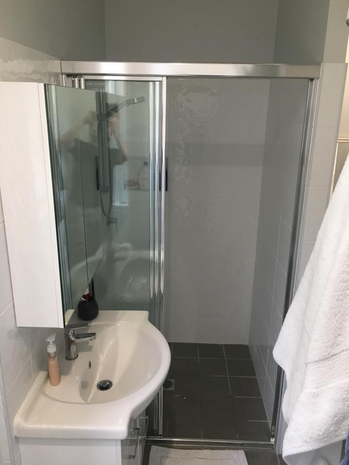 Small Bathroom With Shower Stall, Sink, and Towel Rack — ABV Plumbing In Woy Woy, NSW