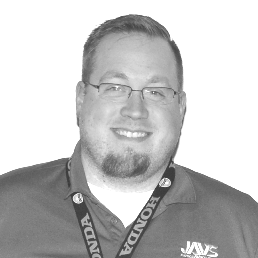 A man wearing a honda lanyard around his neck