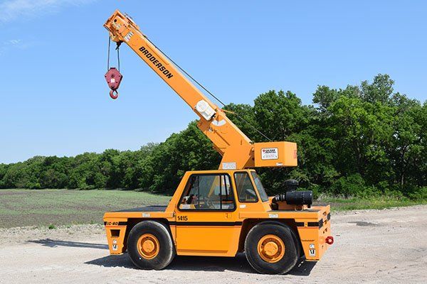 image of orange and black broderson carry deck crane