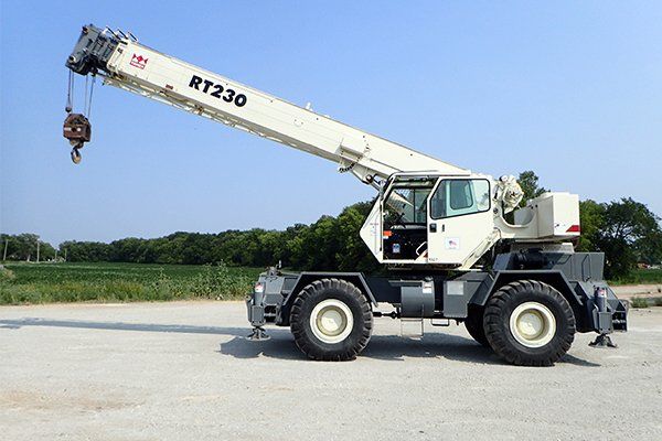 Small white rough terrain crane
