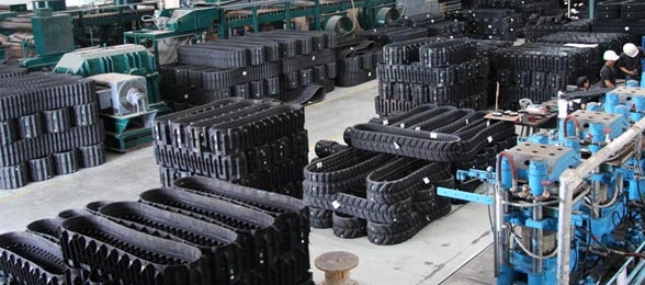 a warehouse filled with lots of rubber tracks and tires