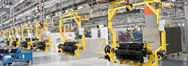 a factory filled with lots of machinery and vehicles .