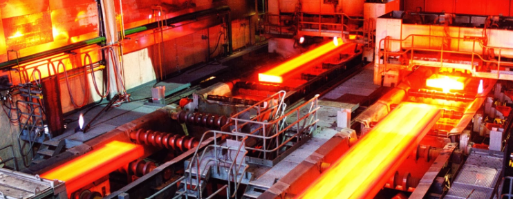 a large factory filled with lots of hot metal .