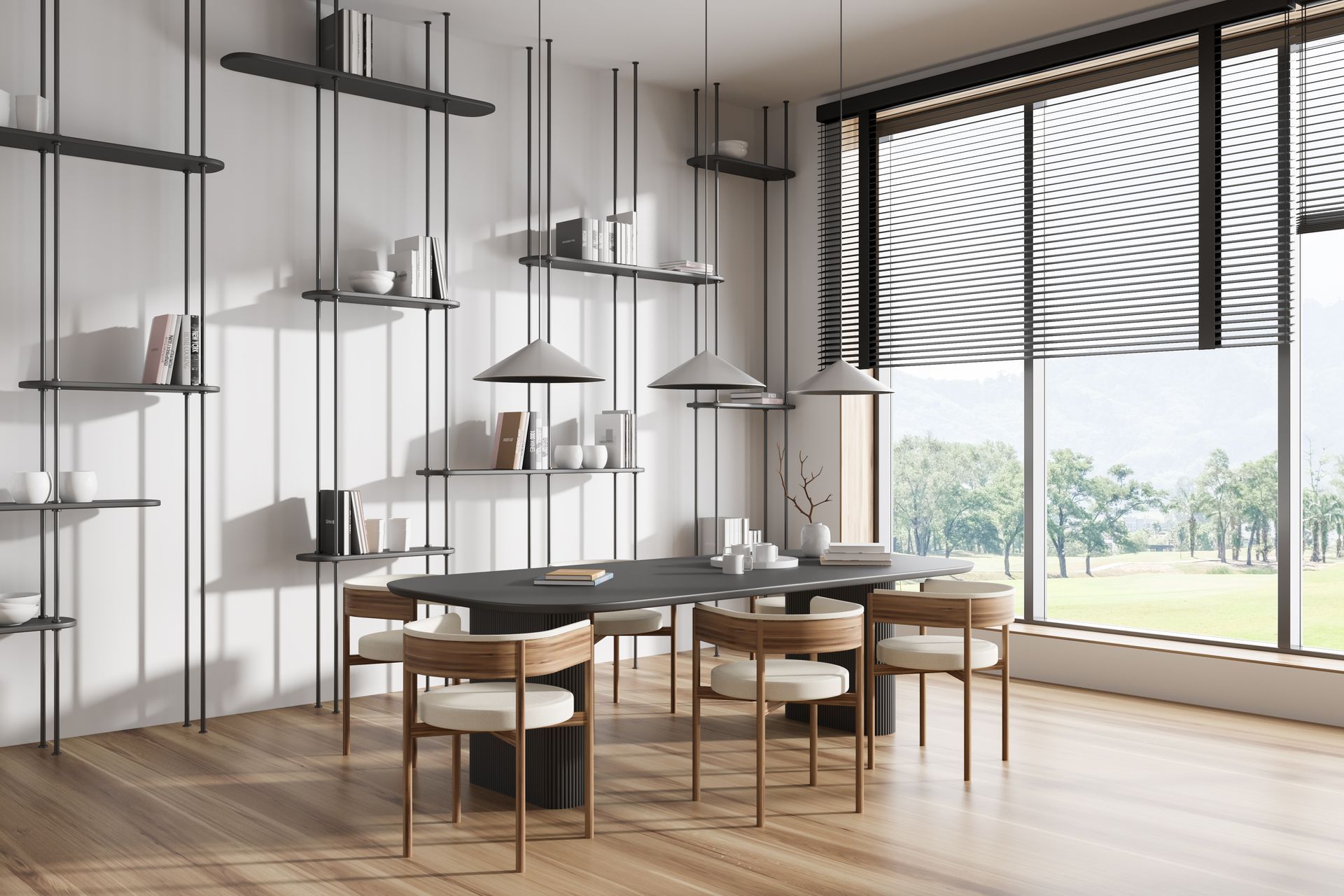 Modern dining room with a long black table, six chairs, shelving unit, and large window overlooking a green landscape.