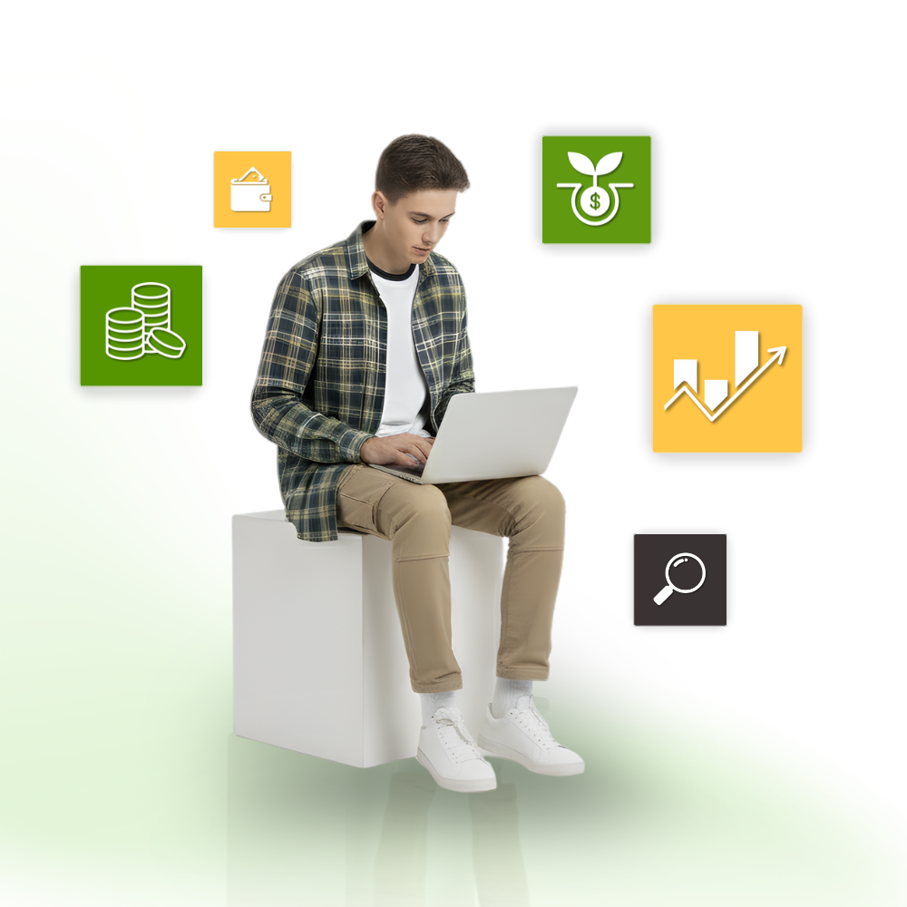 Man using laptop with financial icons on white cube, light green background.