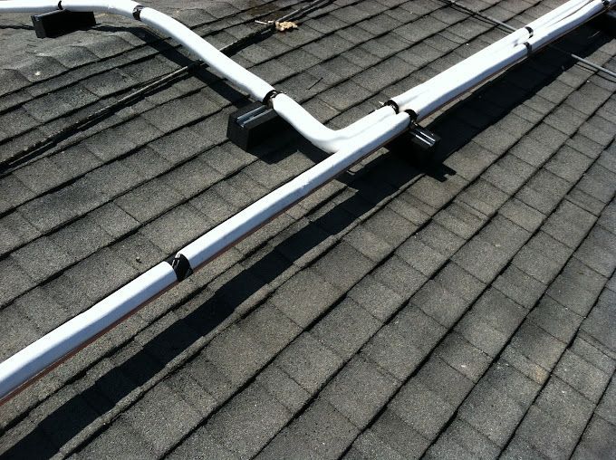A roof with a bunch of pipes on it