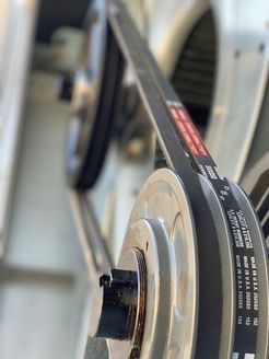 A close up of a belt on a machine.