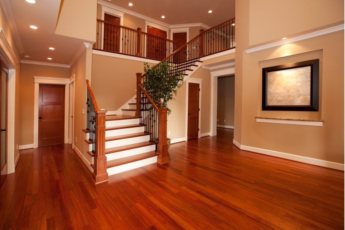 Image of beautifully restored hardwood floors and staircase of luxury home in Toledo, OH