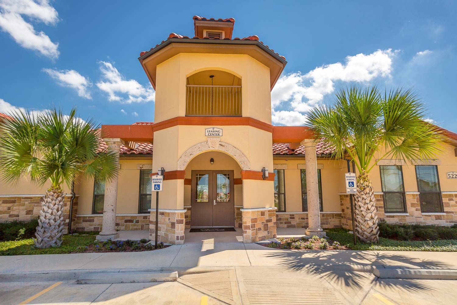 A large building with palm trees in front of it