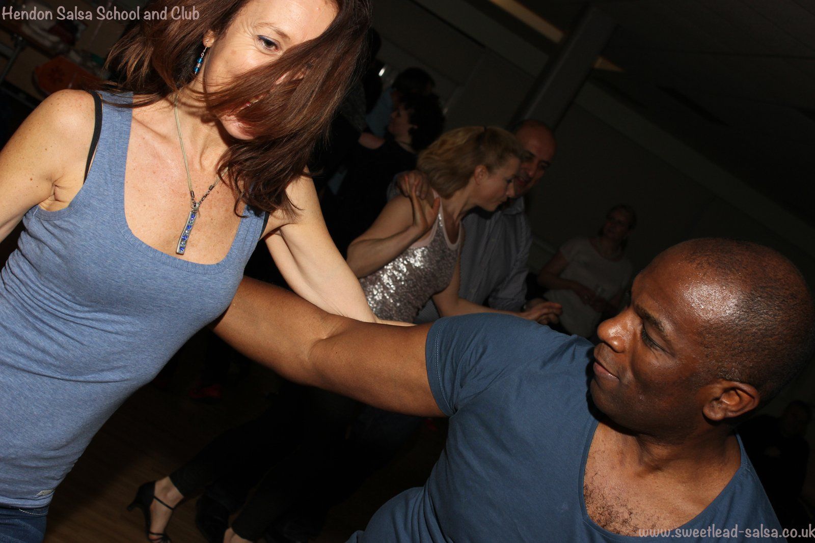 Photo of  people salsa dancing