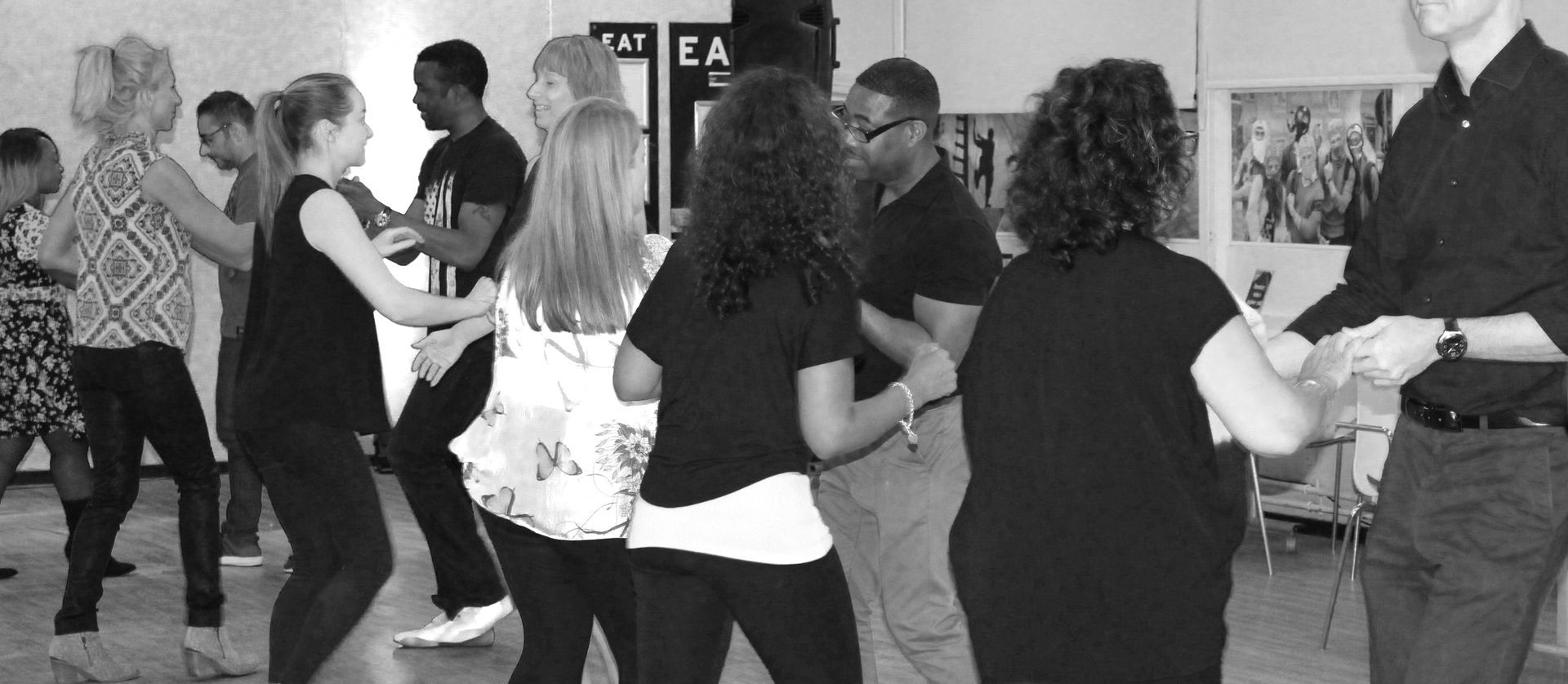 Singles and couples taking their first salsa class