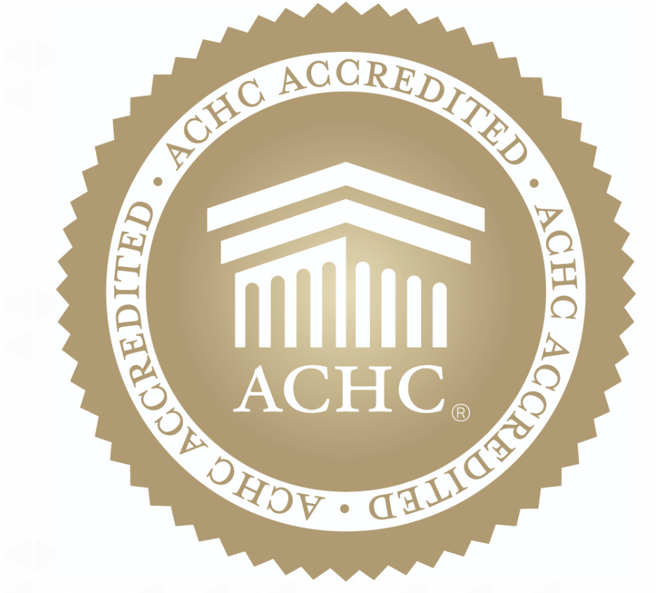 ACHC Accredited seal with building illustration. Golden color.