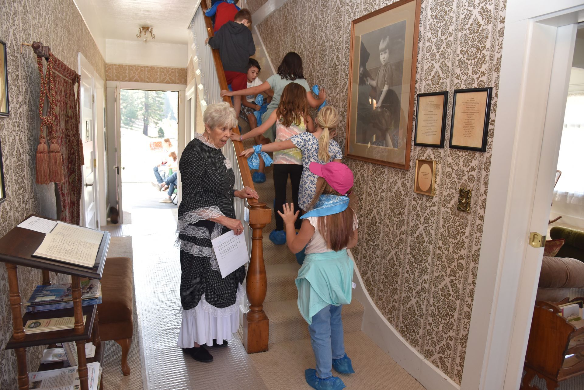 A group of children are walking up a set of stairs.